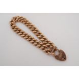 A 9 ct rose gold curb link bracelet, having a padlock clasp, 18.5 cm, 20.3 g