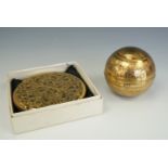 A Stratton powder compact together with gilt metal spherical compact