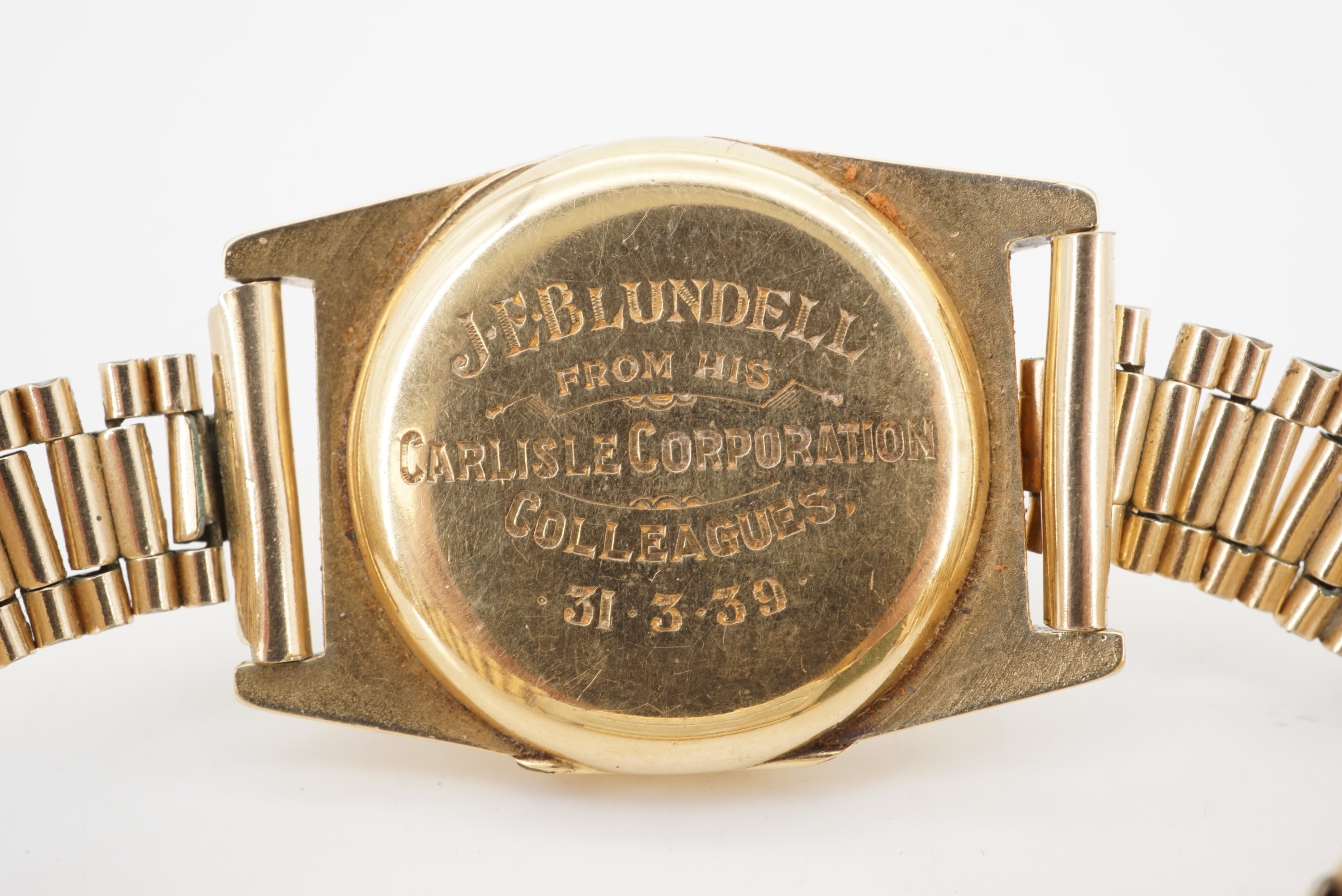 A 1930s Centaur 18ct gold wristwatch having a tonneau shaped case on a rolled gold bracelet strap, - Image 2 of 4