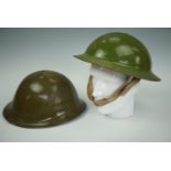 Two Second World War British army steel helmets