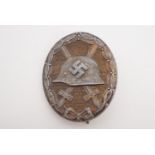 A German Third Reich wound badge, retaining traces of gold finish