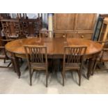 A good George V Hepplewhite influenced mahogany dining suite, comprising an oval wind-out dining