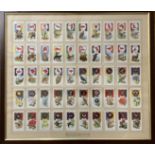 Framed sets of cigarette cards, "Boy Scout and Girl Guide patrol signs and emblems" (1933), 53 x