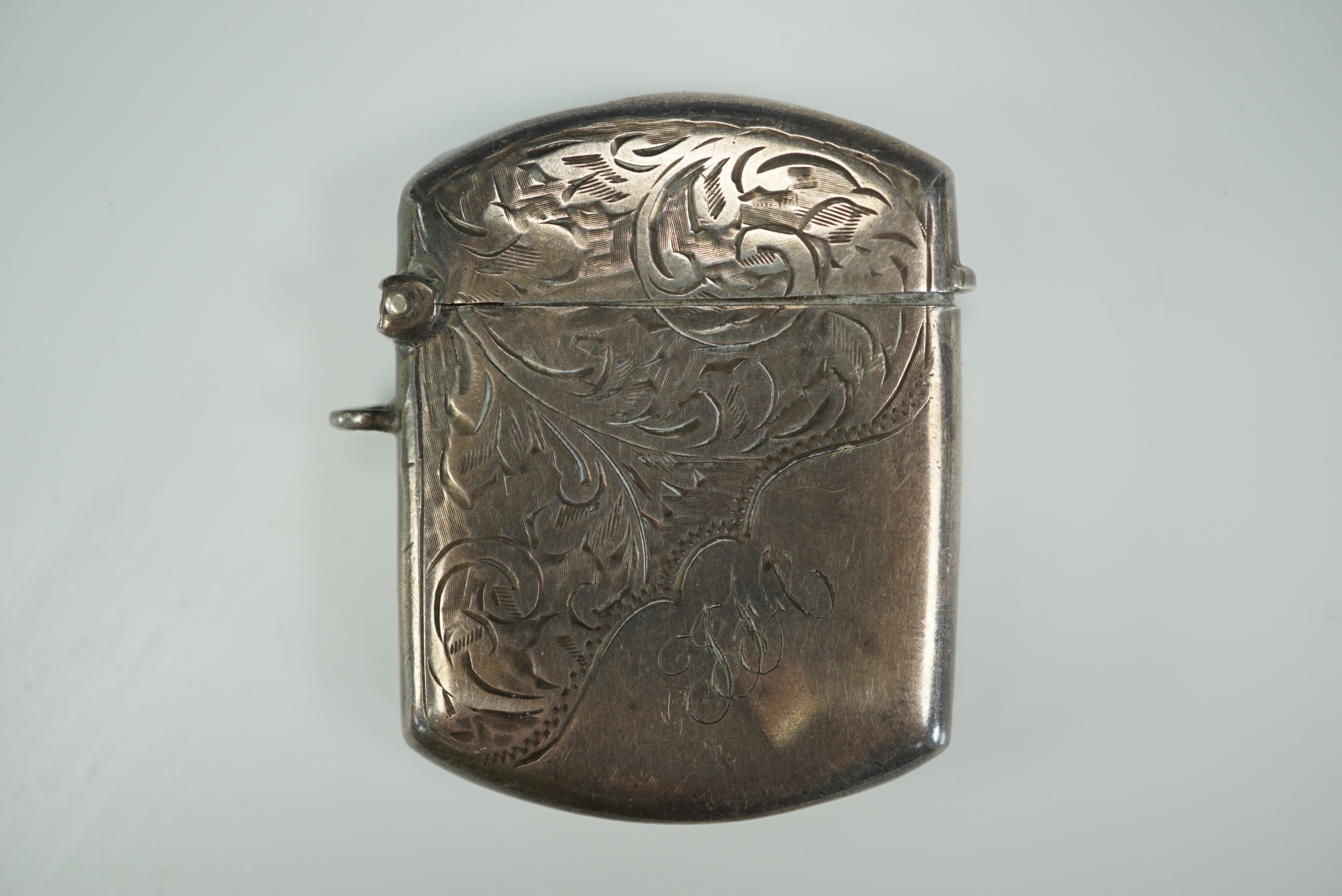 A silver monogrammed vesta case
