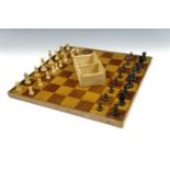 A late 19th / early 20th Century parquetry reversible chess and checkers board together with a boxed