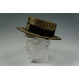 A vintage straw boater, size 6 3/4