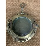 A wreck recovered ship's porthole, 34 cm