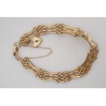 A 9 ct gold cusped gate link bracelet, 10.9 g