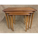 A Scandinavian nest of teak tables