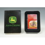 A Zippo John Deere promotional cigarette lighter