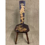 An Arts and Crafts influenced spinning stool, bearing pen-work rose blossom decoration, 92 cm