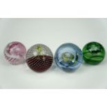 Four Caithness paperweights