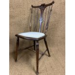 A late Victorian bedroom chair, having a slender-spindle back with pierced splat CF
