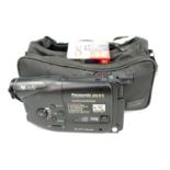 A Panasonic NV-R11 VHS-C camera and accessories