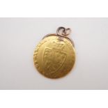 A George III gold shield guinea fob, 8.2 g