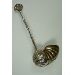 An electroplate condiment ladle in the form of a shell