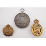 A 1943 West India Football Association Services League winner's medal, together with a 1915