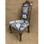 A Victorian upholstered walnut William III influenced standard chair