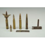 Inert military rifle cartridges, a Mauser stripper clip, an artillery igniter etc