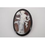 A Victorian shell cameo and faux jet oval brooch, 4.5 cm x 3.5 cm