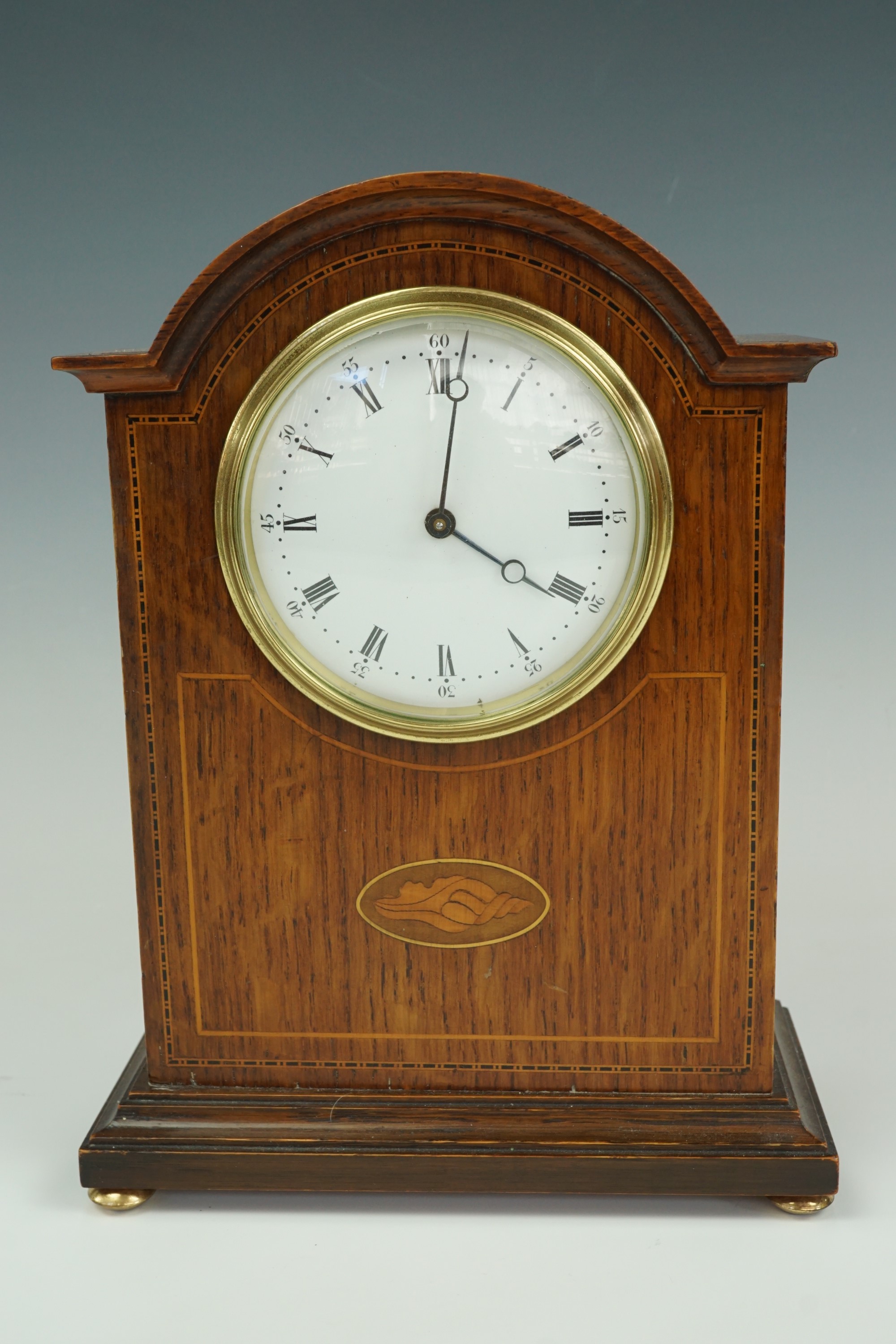 A French oak mantle clock, 23 cm wide