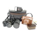 A Minolta X-700 camera, Tokina S2-X 60-300mm 1:4-5.6 lens, Cobra D300 flashgun, Agfa Ambi Silette