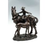 A cold cast bronze sculpture of a Western cow girl, 41 cm