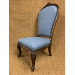 A Victorian carved and upholstered mahogany nursing chair