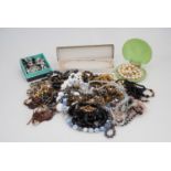 A quantity of vintage and contemporary costume jewellery necklaces