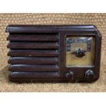 An Art Deco influenced Bakelite radio, 24 cm x 16 cm x 16 cm