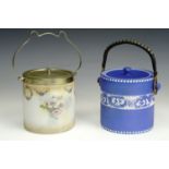 A 1920s Tams Ware blue and white biscuit barrel together with another by Adams (a/f)