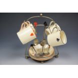 A 1920s Royal Venton Ware "bridge" coffee set with spoons and electroplate stand, the spoon