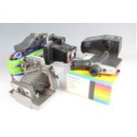 A Polaroid Automatic 103 Land Camera together with a Polavision Land Camera and three other Polaroid