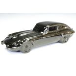 A glazed ceramic model of a Jaguar E-Type, 38 cm