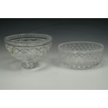 A Waterford cut glass bowl, cross cut sides and comb cut edge raised on a foot with a Stuart