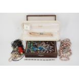 A quantity of vintage costume jewellery including simulation pearls, a wooden box etc