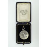 A late 19th / early 20th Century 16th (Queen's) Lancers white metal prize medallion