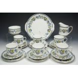 Paragon six piece 'Comtessa' teaset, white body with blue and yellow floral decoration.