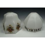 Two enamelled glass pendant light shades, one enamelled in a continues band depicting children at