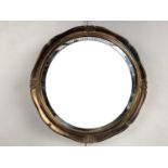 A gilt-framed circular wall mirror, 46 cm