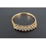 A diamond half hoop eternity ring, the brilliants claw set on an 18 ct gold shank, Q/R, 1.6 g