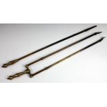 A set of Victorian Aesthetic brass fire tongs together with a matching poker, longest 59 cm