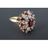 A vintage garnet and white stone cluster ring, the stones set on 9 ct gold, P/Q, 3.7 g