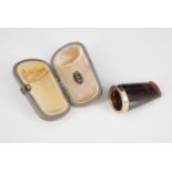A 9 ct gold collared amber cigar holder, cased