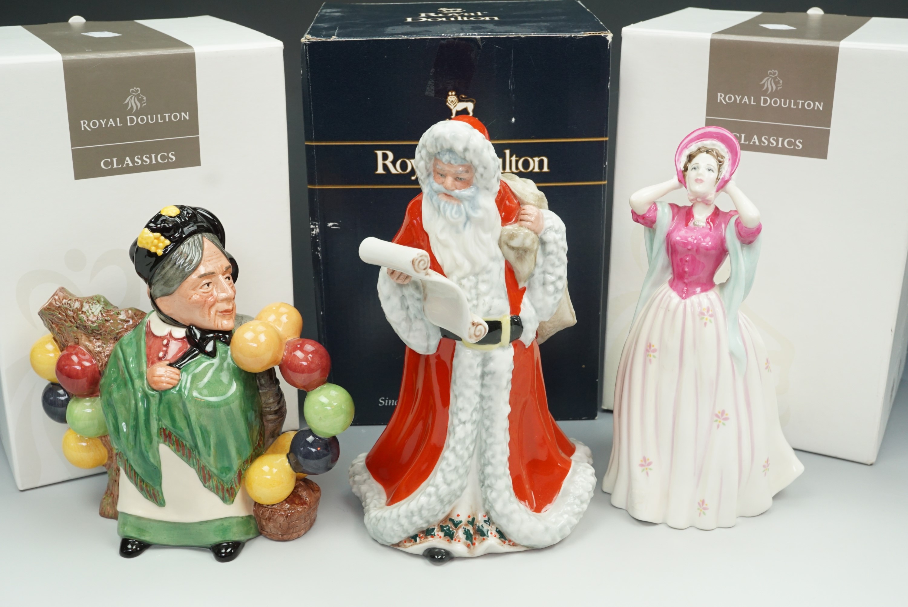Royal Doulton boxed figures, 'Gentle Breeze' and 'Father Christmas', and boxed 'Balloon Man/