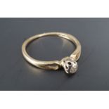 A vintage diamond solitaire engagement ring, the brilliant-cut stone illusion claw set between the