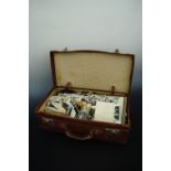 A faux leather suitcase containing a large quantity of Victorian and later post cards, cartes de