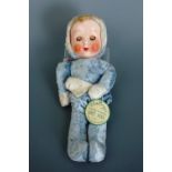 A vintage "Gladeyes" sleeping and winking soft doll, with original tag, 40 cm