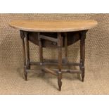 A 1930s diminutive oak gate-leg table, 70 cm x 68 cm x 50 cm