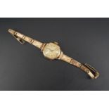 A 1920s lady's rolled gold wristlet watch, (a/f)